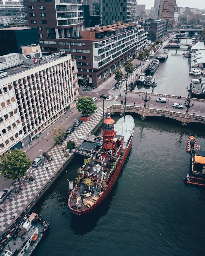 An aerial view of Wijnhaven in Rotterdam with a red lightship.